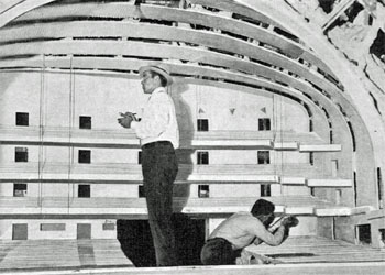 Radio City Music Hall architects at work in a model of the music hall